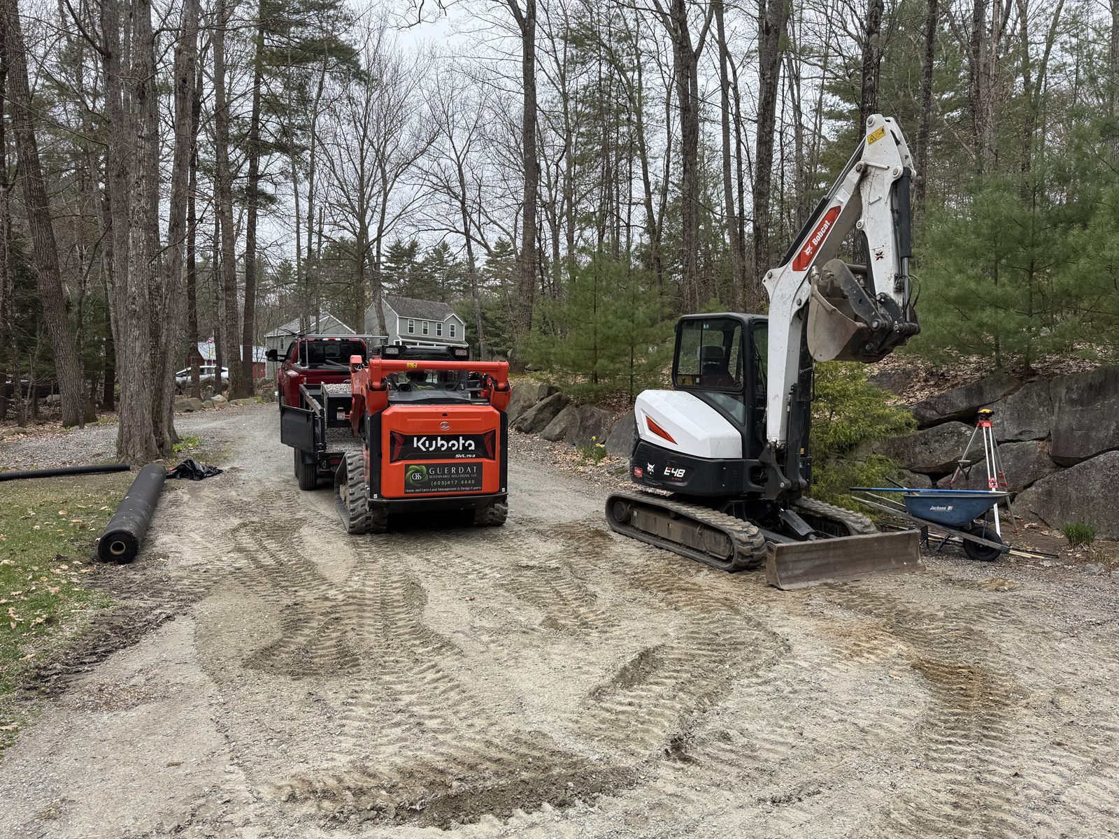 Excavator and skid steer on a residential drainage site — GSS, Seacoast NH