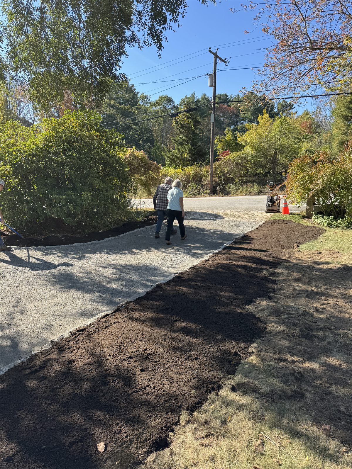 Freshly compacted gravel driveway with a crisp graded edge — GSS New Hampshire
