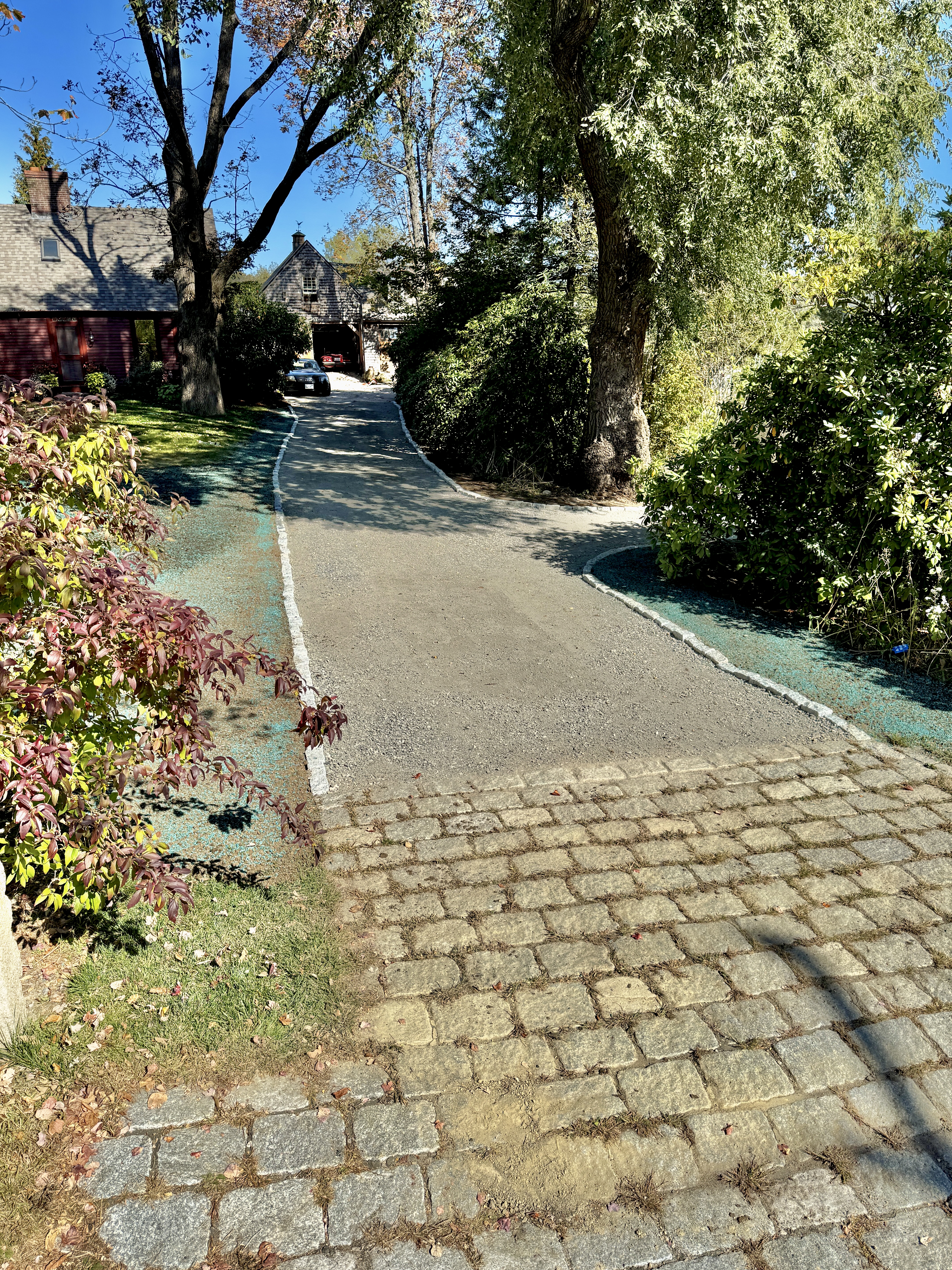 Gravel driveway with cobblestone apron and engineered drainage — GSS Landcrafting, Seacoast NH